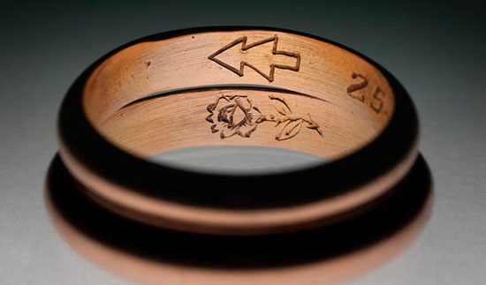 Wedding ring engraved with a rose and a pine tree