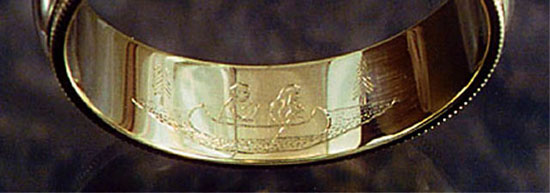 Wedding ring engraved with a canoe